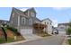 Rear exterior shows the garage, deck, and the neighborhood at 2003 Haley Walk, Woodstock, GA 30188