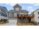 Rear view of home with garage, deck, and access to backyard at 2003 Haley Walk, Woodstock, GA 30188