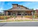 Beautiful clubhouse featuring a covered porch and stylish architectural details and great natural light at 2003 Haley Walk, Woodstock, GA 30188