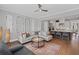 Open concept living room and kitchen area, featuring hardwood floors and neutral decor at 2003 Haley Walk, Woodstock, GA 30188