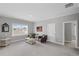 Spacious living room with neutral carpet, two chairs and lots of natural light at 2003 Haley Walk, Woodstock, GA 30188