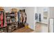 Spacious walk-in closet with ample storage, featuring built-in shelving, drawers and clothing racks at 2003 Haley Walk, Woodstock, GA 30188