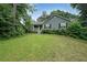 Inviting one-story home with a front porch, dark shutters, and fresh landscaping at 251 Lambeth Dr, Hiram, GA 30141