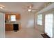 Efficient kitchen with wooden cabinets, black appliances, and a view to the backyard at 251 Lambeth Dr, Hiram, GA 30141