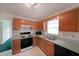 Practical kitchen layout with oak cabinets and essential appliances at 251 Lambeth Dr, Hiram, GA 30141