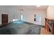 Spacious living room with high ceilings, a fireplace, and views into the kitchen at 251 Lambeth Dr, Hiram, GA 30141
