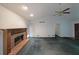Open living space with a brick fireplace, ceiling fan, and natural light at 251 Lambeth Dr, Hiram, GA 30141