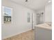 Bathroom with a view, featuring a large window and modern vanity at 45 Vermillion Trl, Covington, GA 30016