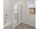 Bathroom featuring a tub, glass shower, and natural light; experience pure indulgence at 45 Vermillion Trl, Covington, GA 30016