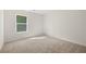Bedroom with neutral walls, carpet and natural light from the window at 45 Vermillion Trl, Covington, GA 30016