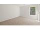 Bedroom with neutral walls, carpet and a window providing natural light at 45 Vermillion Trl, Covington, GA 30016