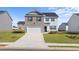 Charming two-story home with a brick and siding exterior, attached garage, and well-manicured lawn at 45 Vermillion Trl, Covington, GA 30016