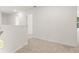 Upstairs hallway with neutral walls, carpet, and doors leading to bedrooms at 45 Vermillion Trl, Covington, GA 30016