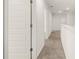 Hallway featuring white doors and trim and neutral carpet at 45 Vermillion Trl, Covington, GA 30016