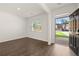 Welcoming room with wood floors and sunlit window, offering a cozy space to unwind and enjoy at 45 Vermillion Trl, Covington, GA 30016