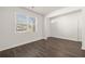 Bright living room features dark wood floors and a large window at 45 Vermillion Trl, Covington, GA 30016
