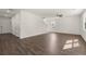 Open concept living space with dark wood floors, neutral walls and many windows at 45 Vermillion Trl, Covington, GA 30016