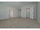 Spacious carpeted bedroom with vaulted ceilings, an ensuite, and a walk-in closet at 48 Beaver Pt, Villa Rica, GA 30180