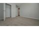 Bedroom with an open closet and doorway with neutral carpet and walls at 48 Beaver Pt, Villa Rica, GA 30180