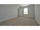 Cozy bedroom with neutral carpet, a window, and closet at 48 Beaver Pt, Villa Rica, GA 30180