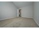 Carpeted bedroom featuring vaulted ceilings, a closet, and neutral decor at 48 Beaver Pt, Villa Rica, GA 30180
