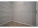 Walk-in closet with adjustable wire shelving and neutral carpet at 48 Beaver Pt, Villa Rica, GA 30180