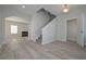 Inviting foyer with hardwood floors, staircase, neutral color scheme, and seamless transition to other living spaces at 48 Beaver Pt, Villa Rica, GA 30180