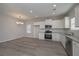 Modern kitchen with stainless steel appliances, granite countertops, and white cabinets offering ample storage at 48 Beaver Pt, Villa Rica, GA 30180