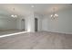 Open-concept living room with light gray walls, light gray floors and modern lighting at 48 Beaver Pt, Villa Rica, GA 30180
