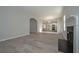 Spacious living room with hardwood floors seamlessly transitions into the kitchen through an arched doorway at 48 Beaver Pt, Villa Rica, GA 30180