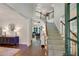 Grand foyer showcasing a staircase, hardwood floors, and natural light, creating a welcoming entrance at 6009 Castleton Mnr, Cumming, GA 30041