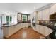 Spacious kitchen with center island, stainless appliances, and hardwood floors at 6009 Castleton Mnr, Cumming, GA 30041