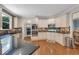 Well-equipped kitchen boasting granite countertops, stainless steel appliances, and ample cabinet space at 6009 Castleton Mnr, Cumming, GA 30041