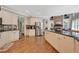 Spacious kitchen with granite countertops, a large island, and open layout, perfect for entertaining and daily life at 6009 Castleton Mnr, Cumming, GA 30041