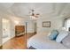 This spacious main bedroom features a trey ceiling, hardwood floors, and ensuite bathroom at 6009 Castleton Mnr, Cumming, GA 30041