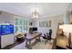 Charming office with a large window, custom light fixture, and a beautiful, decorative accent wall at 6009 Castleton Mnr, Cumming, GA 30041