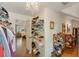 A walk-in closet with shelves and hanging storage is located off the main bedroom at 6009 Castleton Mnr, Cumming, GA 30041