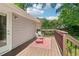Back deck featuring a seating area and view of the lush green lawn and mature trees at 34 Clifton Se St, Atlanta, GA 30317