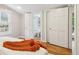 Cozy bedroom with hardwood floors leads to an en-suite bathroom and closet for added convenience at 34 Clifton Se St, Atlanta, GA 30317