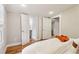 Bright bedroom offers hardwood floors, closet, and bathroom access, designed for modern living at 34 Clifton Se St, Atlanta, GA 30317