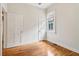 Bright bedroom showcasing hardwood floors, white trim, and natural light at 34 Clifton Se St, Atlanta, GA 30317