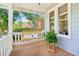 Inviting front porch featuring a porch swing and views of the landscaped neighborhood at 34 Clifton Se St, Atlanta, GA 30317