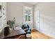 Comfortable home office with stylish decor, a functional desk, and a bright window at 34 Clifton Se St, Atlanta, GA 30317