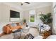 Sunlit living room featuring hardwood floors and contemporary design elements at 34 Clifton Se St, Atlanta, GA 30317