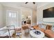 Spacious living room with hardwood floors flowing seamlessly into the dining area at 34 Clifton Se St, Atlanta, GA 30317