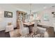 Dining room with hardwood floors, neutral chairs and wooden china cabinet at 351 Gaines St, Marietta, GA 30060