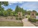 Community entrance featuring brick pillars with signage surrounded by trees and greenery providing a welcoming approach at 351 Gaines St, Marietta, GA 30060
