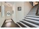 Entryway featuring wood floors, staircase, and glass paneled front door with decorative wreath at 351 Gaines St, Marietta, GA 30060