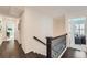 Second floor hallway features dark hardwood floors and a decorative iron railing at 351 Gaines St, Marietta, GA 30060