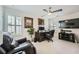 Well-lit home office with a ceiling fan and media center is perfect for remote work at 351 Gaines St, Marietta, GA 30060